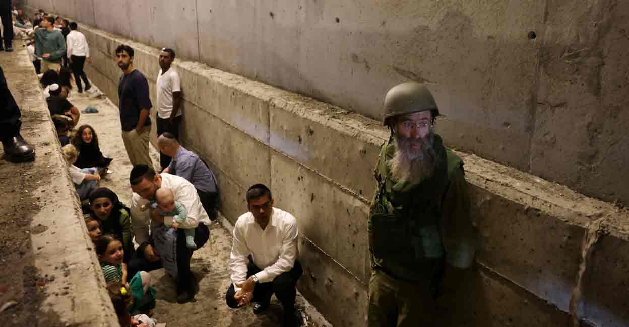 ISRAEL-PALESTINIANS-LEBANON People take shelter during an air raid siren, amid cross-border hostilities between Hezbollah and Israel, in central Israel October 1, 2024. Photo: REUTERS/Ronen Zvulun