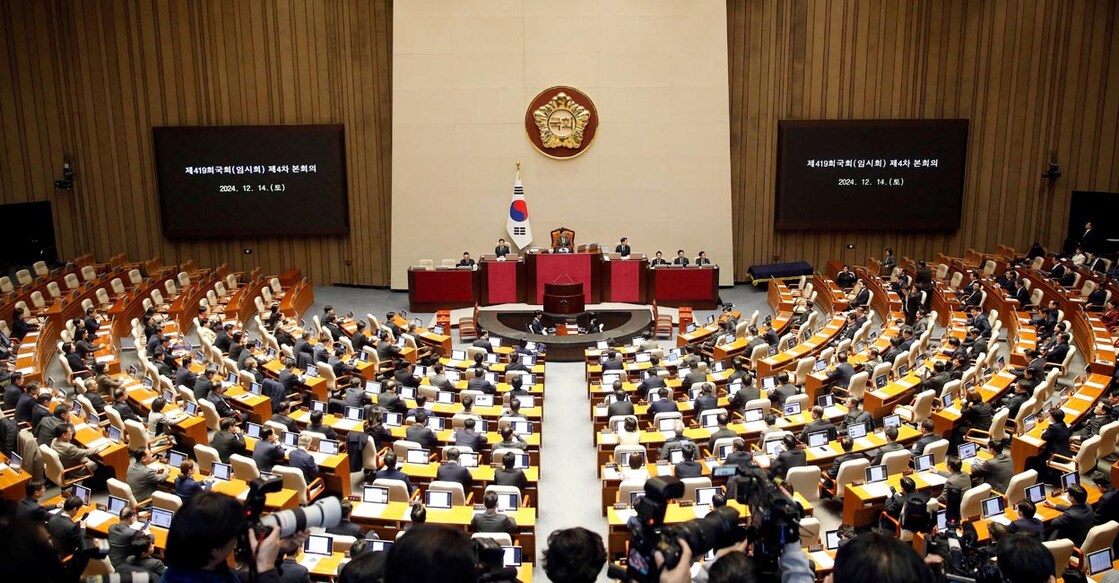 South Korean lawmakers during a plenary session of the impeachment vote of President Yoon Suk Yeol at the National Assembly in Seoul, South Korea. Photo: Woohae Cho/Pool via REUTERS