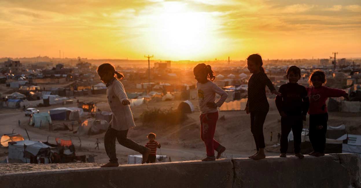 A child growing up in a conflict zone is far more likely to be out of school, malnourished, or forced from their home. Photo: AFP