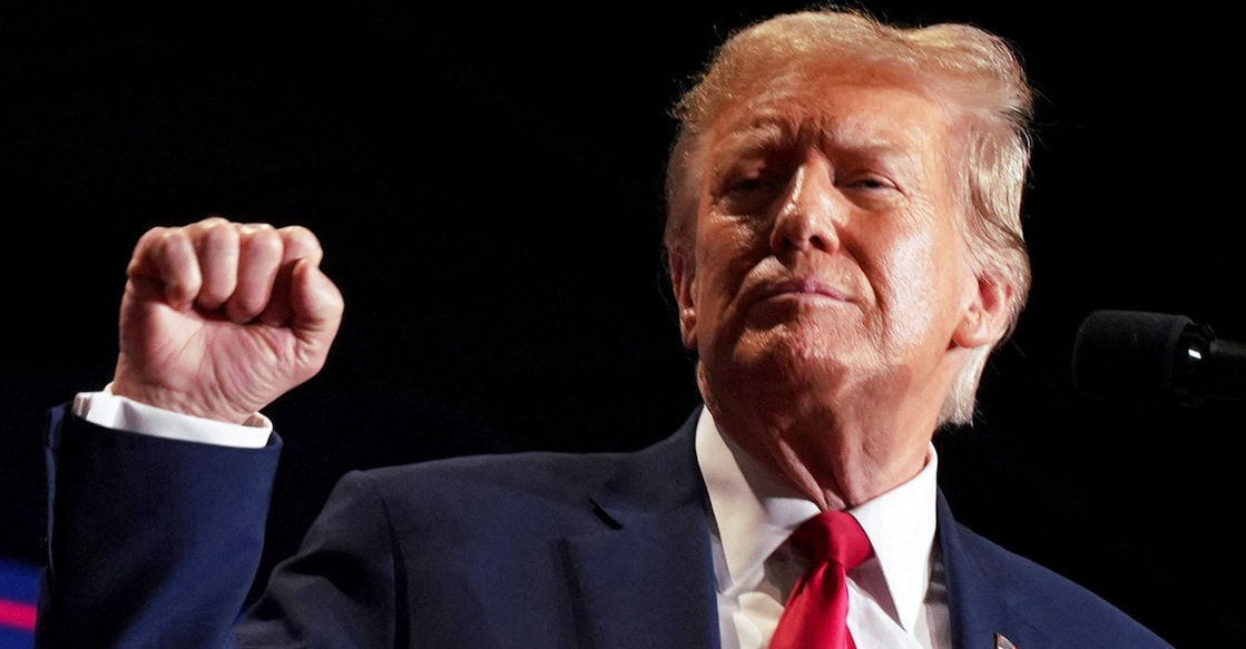 Republican presidential candidate and former US President Donald Trump reacts on stage during a campaign rally in Richmond, Virginia. Photo: Reuters/Jay Paul