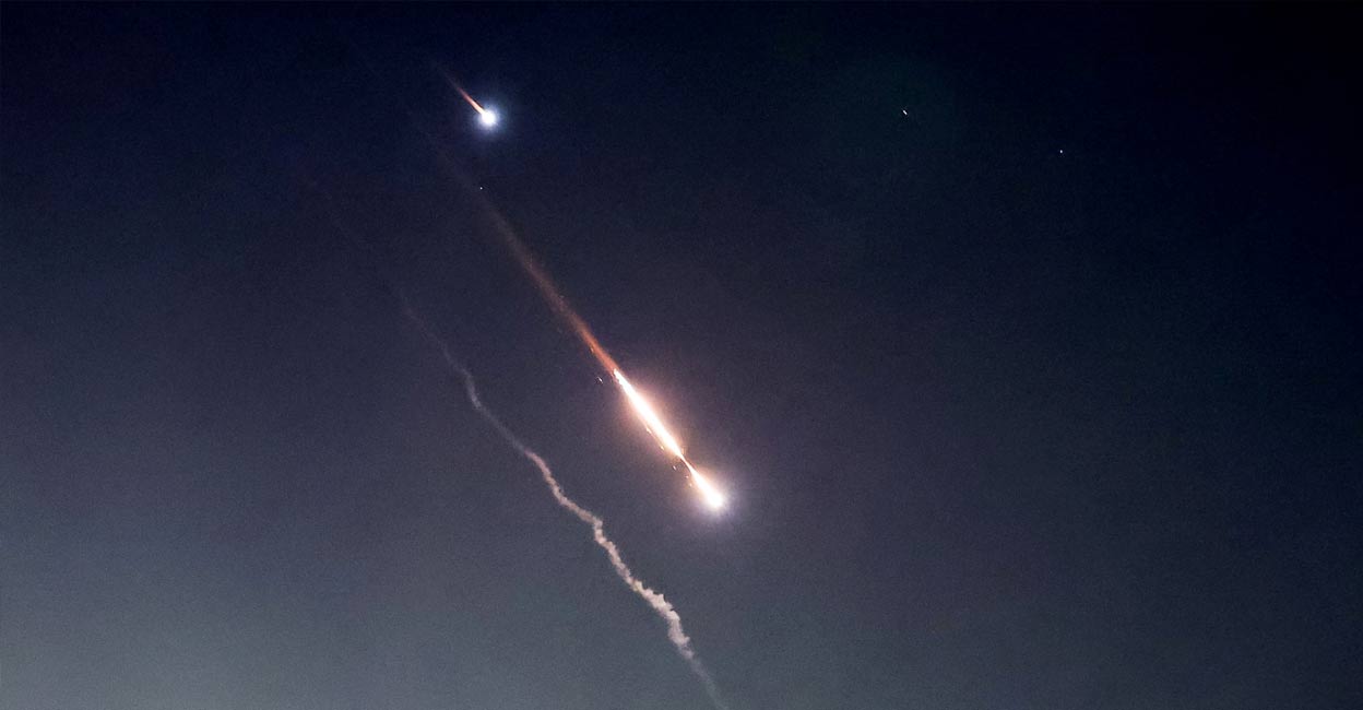 iran-israel-strikes-ls2 Objects are seen in the sky above Jerusalem after Iran launched drones and missiles towards Israel, in Jerusalem April 14, 2024. Photo: Reuters.