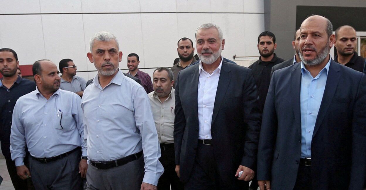 Hamas Gaza Chief Yahya Al-Sinwar, Hamas Chief Ismail Haniyeh and senior Hamas leader Khalil al-Hayya arrive at the Rafah border crossing in the southern Gaza Strip on September 19, 2017. File photo: Reuters/Ibraheem Abu Mustafa 
