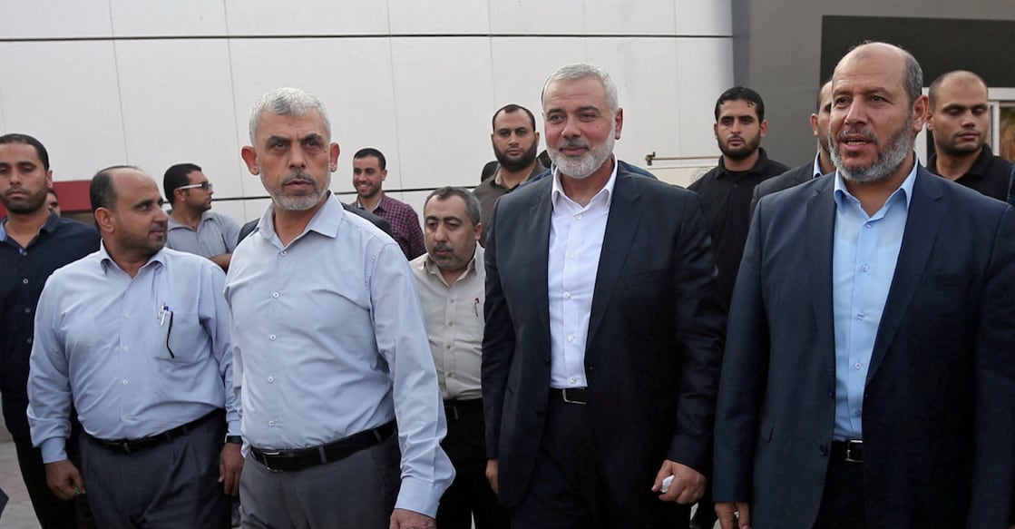 ISRAEL-PALESTINIANS-ICC Hamas Gaza Chief Yahya Al-Sinwar, Hamas Chief Ismail Haniyeh and senior Hamas leader Khalil al-Hayya arrive at the Rafah border crossing in the southern Gaza Strip on September 19, 2017. File photo: Reuters/Ibraheem Abu Mustafa