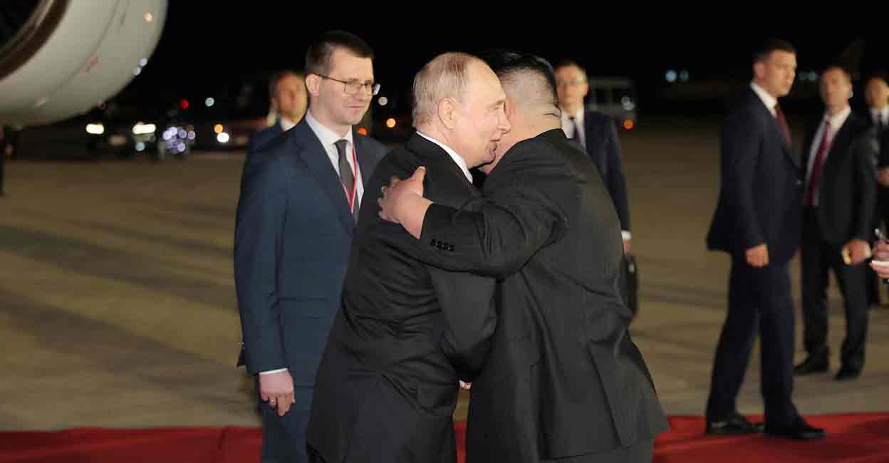 Russian President Vladimir Putin embraces North Korean leader Kim Jong Un upon his arrival at an airport in Pyongyang, North Korea, in this image released by the Korean Central News Agency June 19, 2024. Photo: KCNA via REUTERS