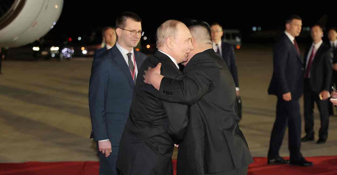 Russian President Vladimir Putin embraces North Korean leader Kim Jong Un upon his arrival at an airport in Pyongyang, North Korea, in this image released by the Korean Central News Agency June 19, 2024. Photo: KCNA via REUTERS