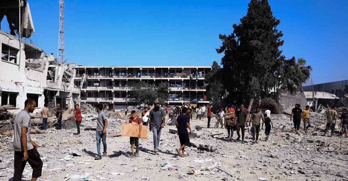 Palestinians gather to inspect the damages at the headquarters of UNRWA, following an Israeli raid, amid the Israel-Hamas conflict, in Gaza City, July 12, 2024. REUTERS/Dawoud Abu Alkas