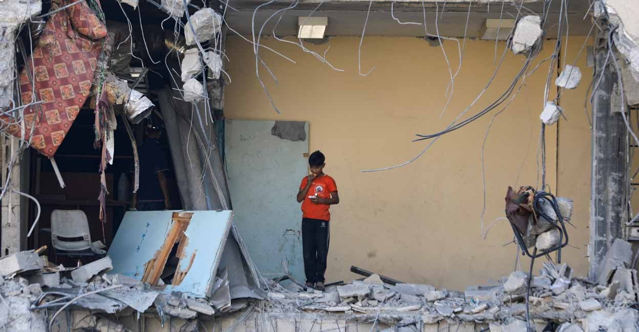 ISRAEL-PALESTINIANS A Palestinian boy stands among rubble, after Israeli forces withdrew from a part of Gaza City, following a ground operation, amid the Israel-Hamas conflict, in Gaza City, July 12, 2024. REUTERS/Dawoud Abu Alkas