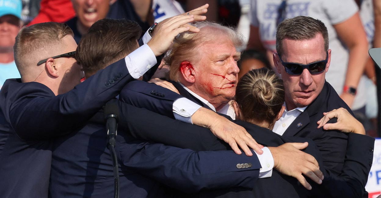 Republican presidential candidate and former US President Donald Trump gestures with a bloodied face as multiple shots rang out during a campaign rally at the Butler Farm Show in Butler, Pennsylvania, US, July 13, 2024. Photo: Reuters. 