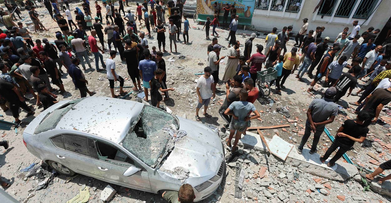 gaza-hamas-palestine-ls Palestinians inspect a school sheltering displaced people following an Israeli strike, amid Israel-Hamas conflict, in Deir Al-Balah in the central Gaza Strip, July 27, 2024. Photo: Reuters.