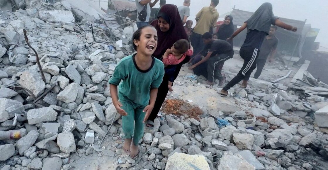 Untitled design - 1 Palestinians react, following an Israeli strike near a UN-run school sheltering displaced people, amid the Israel-Hamas conflict, in Khan Younis, in the southern Gaza Strip, in this still image taken from a video, July 3, 2024. Photo: Reuters/Mohammed Salem