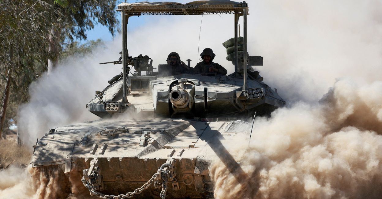Untitled design - 1 An Israeli tank manoeuvres near the Israel-Gaza border, amid the Israel-Hamas conflict, in Israel, July 2, 2024. Photo: Reuters/Ammar Awad