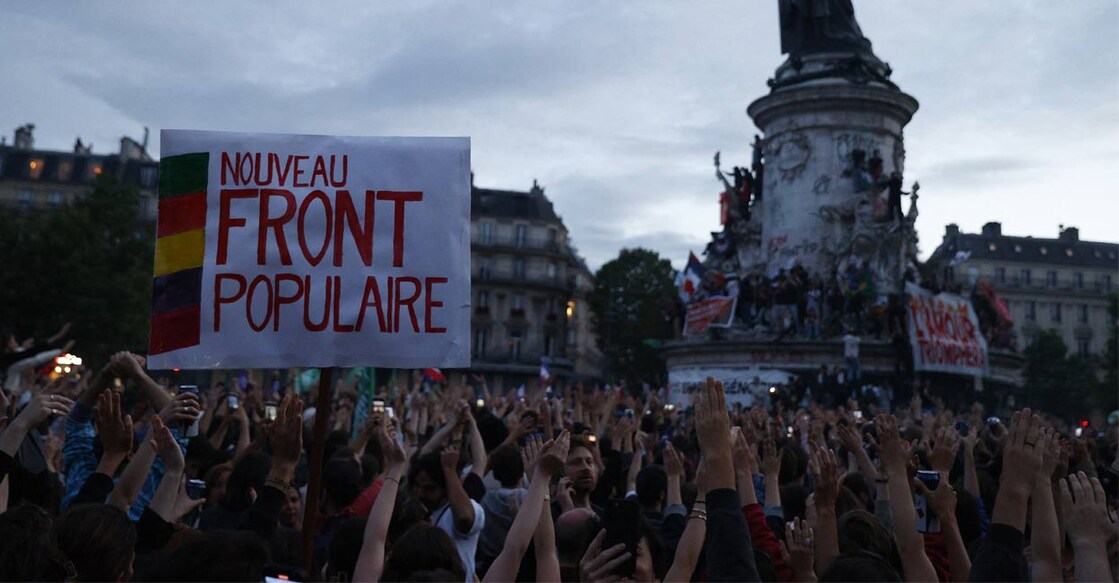 france-elections-ls People raise their arms and hands as they gather at the Place de la Republique after partial results in the second round of the early French parliamentary elections, in Paris, France, July 7, 2024. Photo: Reuters.