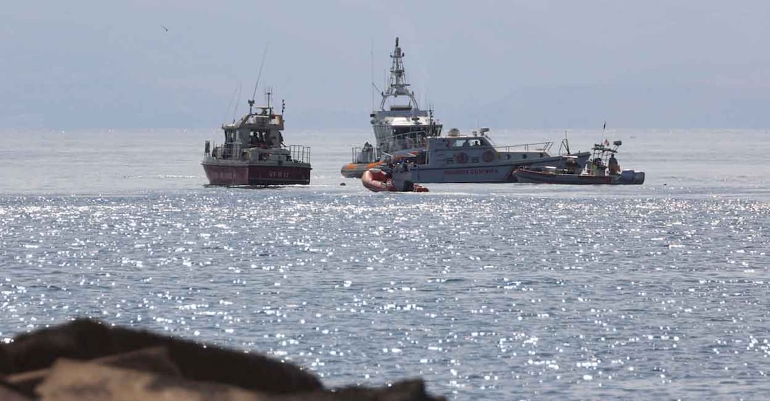 Emergency services work near the scene where a sailboat sank in the early hours of Monday off the coast of Porticello, near the Sicilian city of Palermo. Photo: Reuters/Igor Petyx