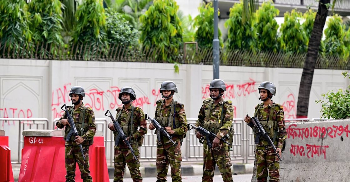 bangladesh-army Bangladesh army personnel stand guard during a curfew following clashes between police and Anti-Discrimination Student Movement activists . Photo: AFP