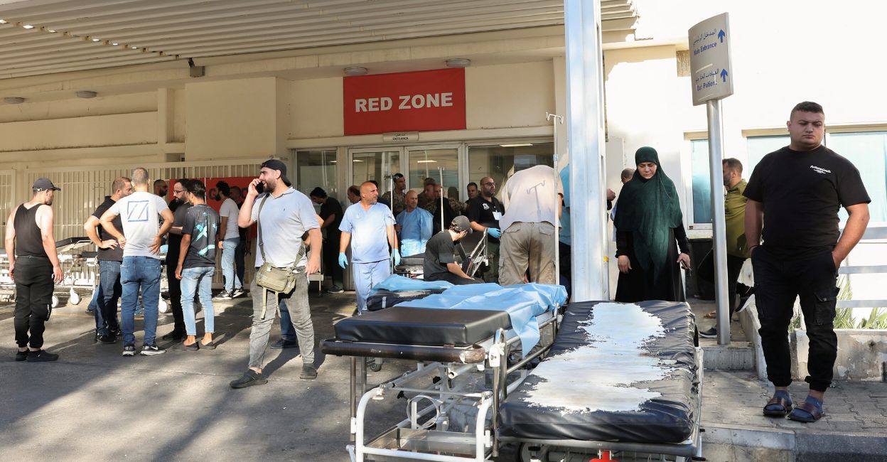 People gather outside a hospital, as hundreds of members of the Lebanese armed group Hezbollah, including fighters and medics, were seriously wounded on Tuesday when the pagers they use to communicate exploded, according to a security source, in Beirut, Lebanon September 17, 2024. Photo: Reuters/Mohamed Azakir