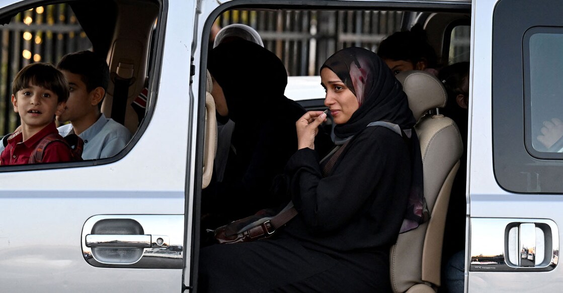 People fleeing from Lebanon arrive on the Syrian side of the border with Lebanon in Jdeidat Yabus in southwestern Syria on September 25, 2024. Photo: AFP/ Louai Beshara