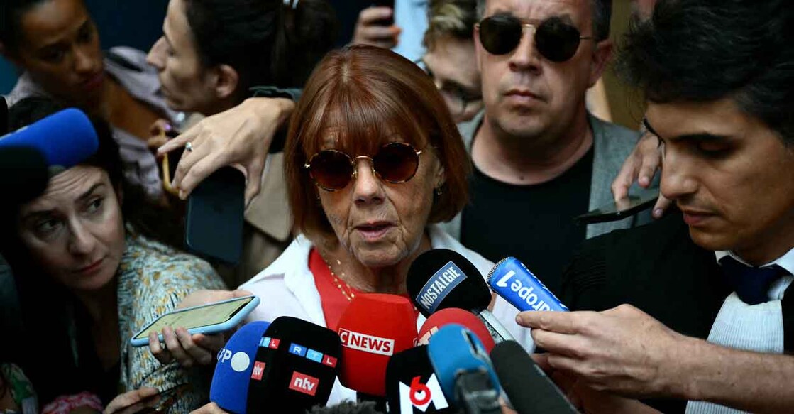 FRANCE-JUSTICE-TRIAL-PROTEST-INVESTIGATION-ASSAULT-WOMEN Gisele Pelicot (centre), escorted by her lawyer Stephane Babonneau (right) and one of her sons David (second from right), addresses media as she leaves the courthouse during the trial of her husband accused of drugging her for nearly ten years and inviting strangers to rape her at their home in Mazan, a small town in the south of France, in Avignon, on September 5, 2024. The case involves 50 co-defendants. The defendants, 18 of whom are on remand, are men aged between 21 and 68 at the time of the events. Photo: AFP