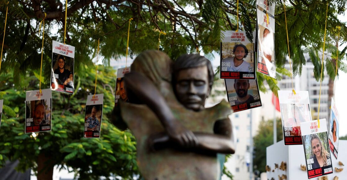 Images of Israeli hostages, who were kidnapped during the deadly October 7, 2023 attack by Hamas, hang from a tree at Hostages Square in Tel Aviv, Israel, January 17, 2025. Photo: Reuters. 