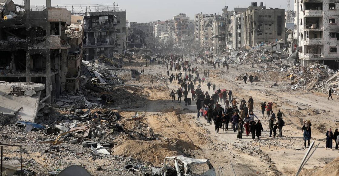 gaza-people-c Displaced Palestinians walk past the rubble as they attempt to return to their homes, following a delay in the ceasefire between Israel and Hamas over the hostage list, in the northern Gaza Strip. Photo: Reuters