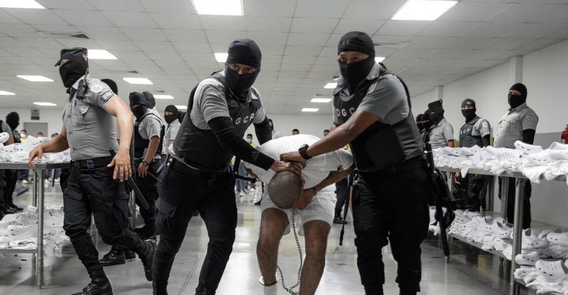 This handout picture released on March 16, 2025, by El Salvador's Presidency press office shows an alleged member of the Venezuelan criminal organization Tren de Aragua upon his arrival at the Terrorism Confinement Center (CECOT) in the city of Tecoluca, El Salvador. Photo: AFP
