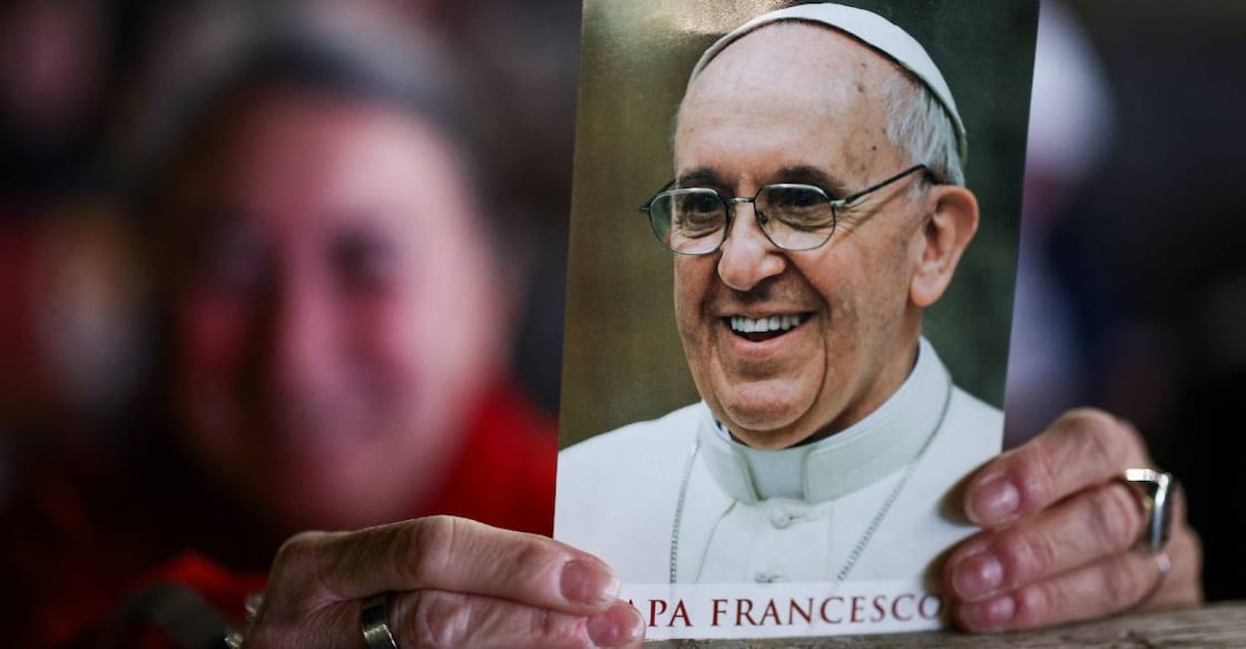 A person holds an image of Pope Francis on the day of a prayer service in St. Peter's square as Pope Francis continues hospitalization, at the Vatican. Photo: Reuters