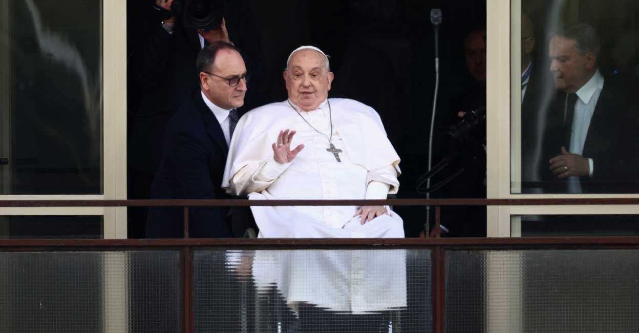 Pope Francis waves during his first public appearance in five weeks, on the day he is set to be discharged from Gemelli Hospital, in Rome, Italy. Photo: REUTERS/Guglielmo Mangiapane