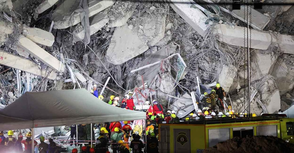 Rescue personnel work at the site of a building that collapsed after a strong earthquake struck central Myanmar on Friday. Photo: Reuters