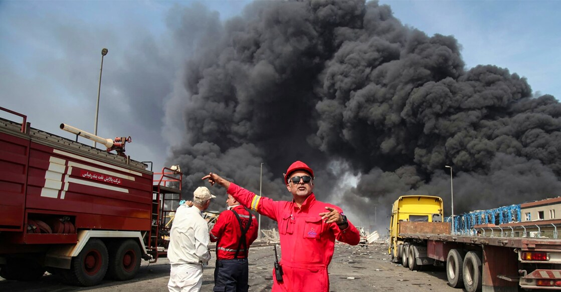 iran-port-blast Rescuers arrive near the source of an explosion at the Shahid Rajaee port dock southwest of Bandar Abbas in the Iranian province of Hormozgan on Saturday. Photo: AFP