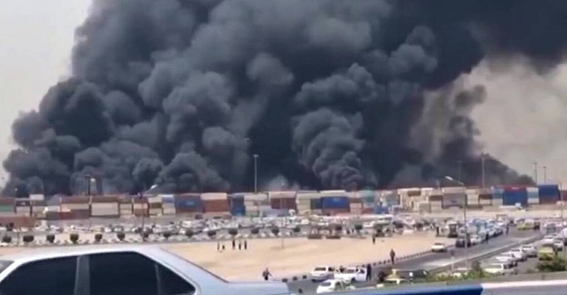 iran-port-c This image grab taken from footage released by the state television Islamic Republic of Iran Broadcasting News shows thick black smoke billowing following an explosion at the Shahid Rajaee port dock southwest of Bandar Abbas in the Iranian province of Hormozgan. Photo: AFP