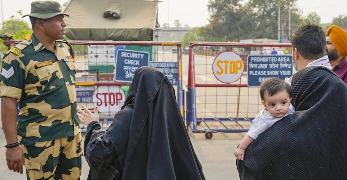 wagah-border-pak-nationals People plead with a BSF official after not being able to cross over to Pakistan, at the Integrated Check-Post near the Attari-Wagah border, in Amritsar district. Photo: PTI