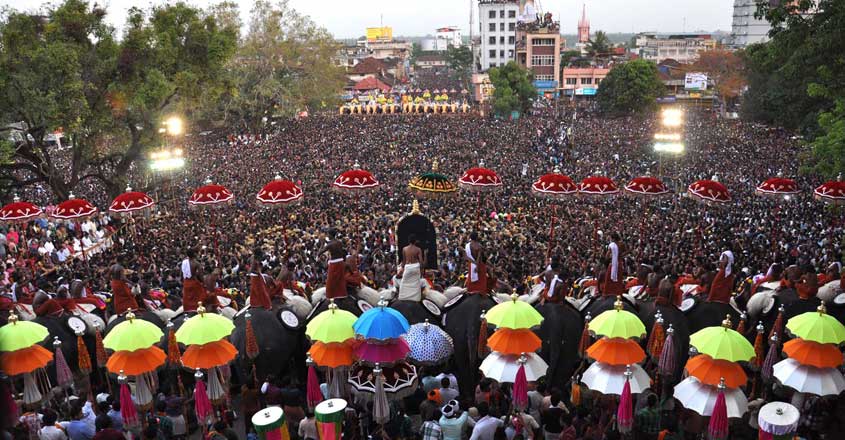 Thrissur pooram Thousands of Pooram fans watch the processions led by caparisoned elephants in Thrissur, in the southern Kerala state on May 1, 2012. The Thrissur pooram, known as mother of all temple fesitvals, was introduced over a century back by the rulers of erstwhile Kochi princely state. Since then, the festival is celebrated every year by people in the locality setting aside even religious divides. AFP PHOTO/ STR (Photo by STRDEL / AFP)