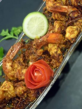 Spicy prawns punch with ginger-garlic marinade