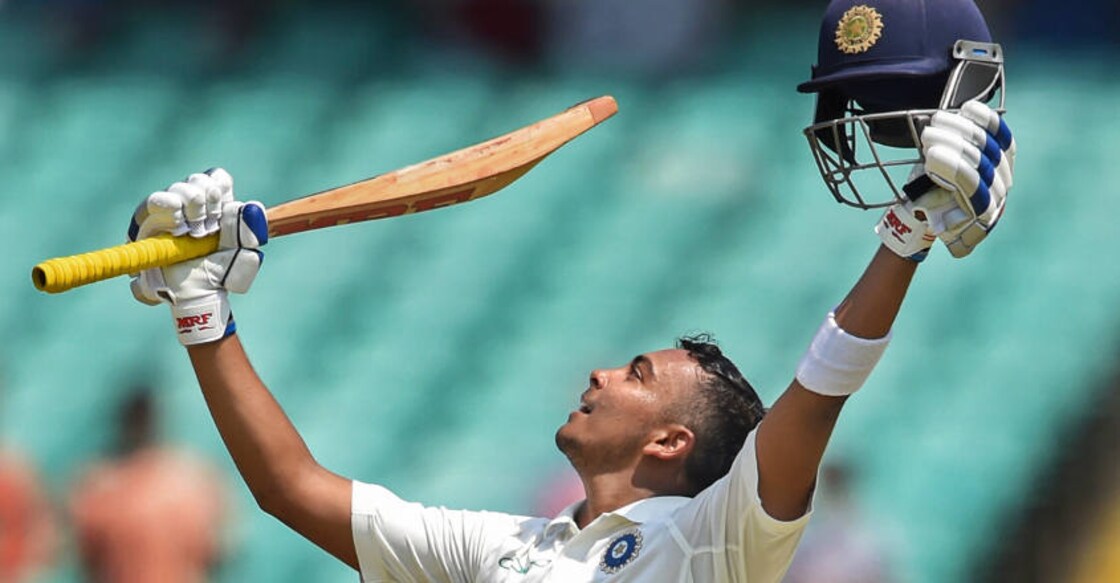 Prithvi Shaw celebrates his century on day one of the 1st Test cricket match against West Indies, in Rajkot. PTI