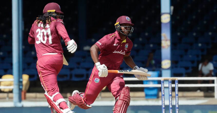 Trinidad India West Indies Cricket West Indies opening batsmen Chris Gayle, left, and Evin Lewis, right, run between the wickets during the third One-Day International cricket match against India in Port of Spain, Trinidad, Wednesday, Aug. 14, 2019. (AP Photo/Arnulfo Franco)