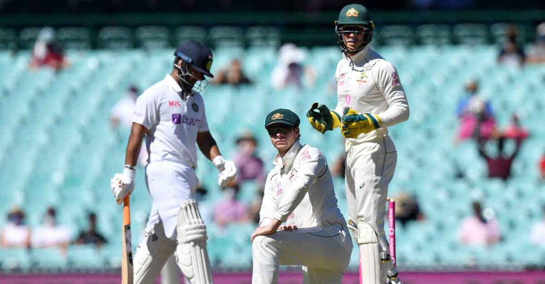 smith-paine Steve Smith and Tim Paine look on during the final day of the Sydney Test. Photo: AFP
