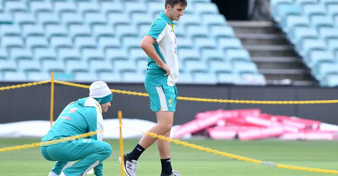 Australian captain Tim Paine, left. and Pat Cummins inspect the Sydney pitch. Photo: AFP