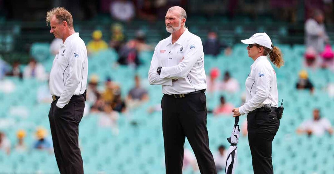 From left: Umpires Paul Reiffel, Paul Wilson and Claire Polosak inspect the field after rain during day one of the Sydney Test. Photo: AFP