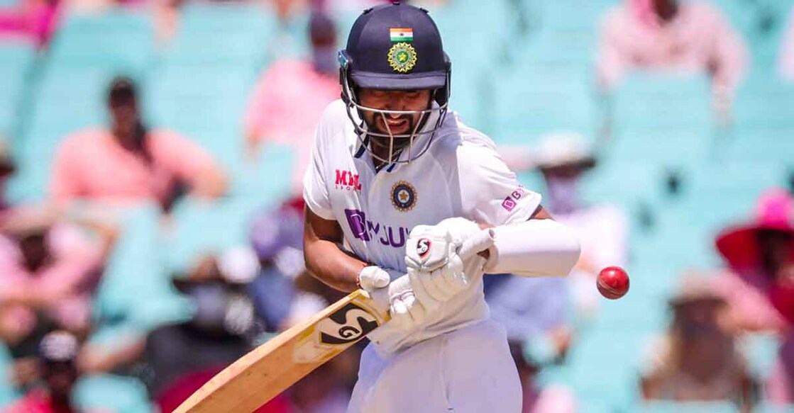Cheteshwar Pujara avoids a short ball on the third morning. Photo: AFP