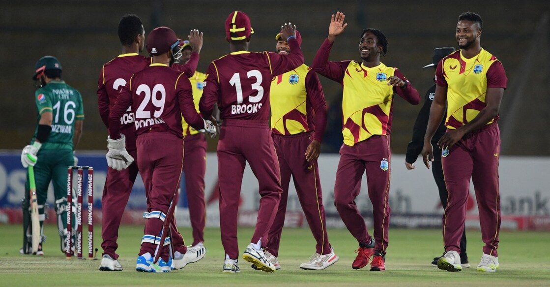 West Indies players celebrate the wicket of Pakistan cricket captain Babar Azam in the second T20I. Photo: AFP/Asif Hassan