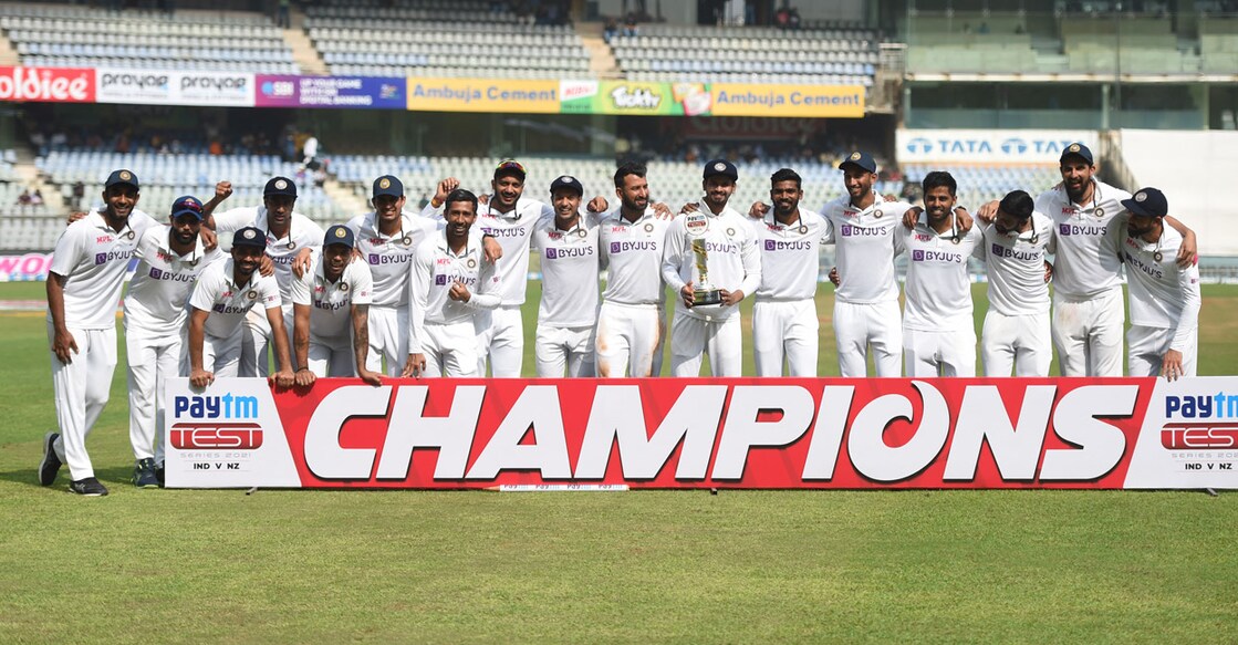 Indian players pose with the trophy. Photo: AFP/Punit Paranjpe