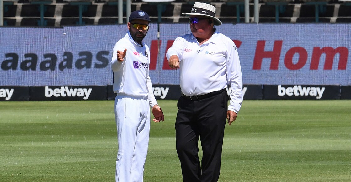 Virat Kohli has a word with South African umpire Marais Erasmus. Photo: AFP/Rodger Bosch