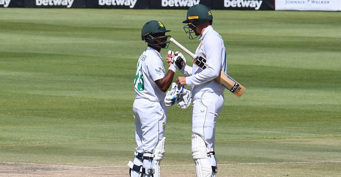 Keegan Petersen is congratulated by Rassie van der Dussen on scoring a half-century. Photo: AFP/Rodger Bosch