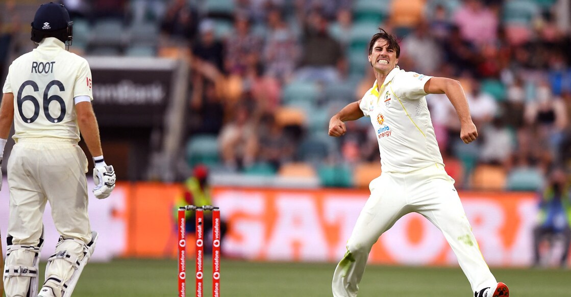 Pat Cummins Pat Cummins is pumped up after dismissing Joe Root. Photo: AFP/William West