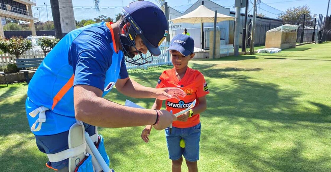 When an 11-year old caught Rohit Sharma's attention at the WACA Rohit Sharma signs an autograph for Drushil Chauhan. File photo: Twitter@BCCI
