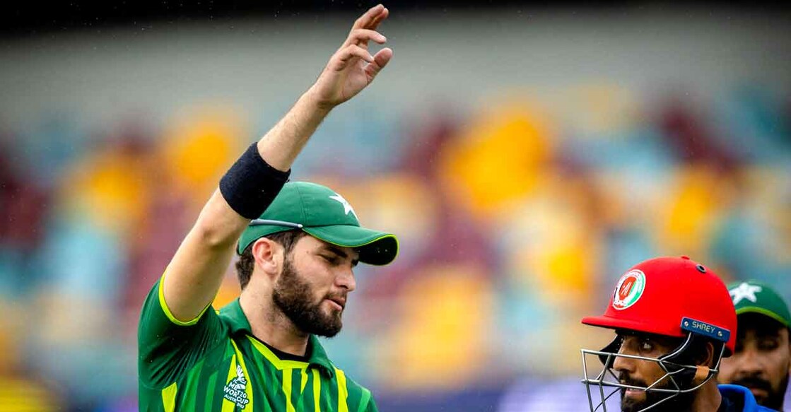 Shaheen Afridi has a word with Afganistan's Usman Ghani. Photo: AFP/Patrick Hamilton