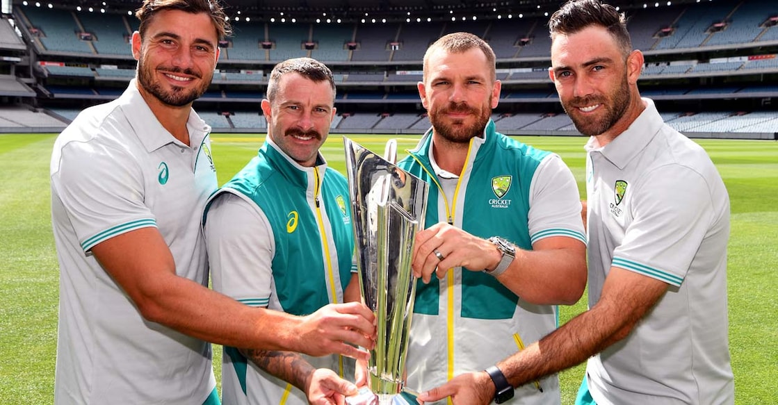Australia's Marcus Stoinis, Matthew Wade, Aaron Finch and Glenn Maxwell pose with the T20 World Cup trophy. File photo: AFP/William West