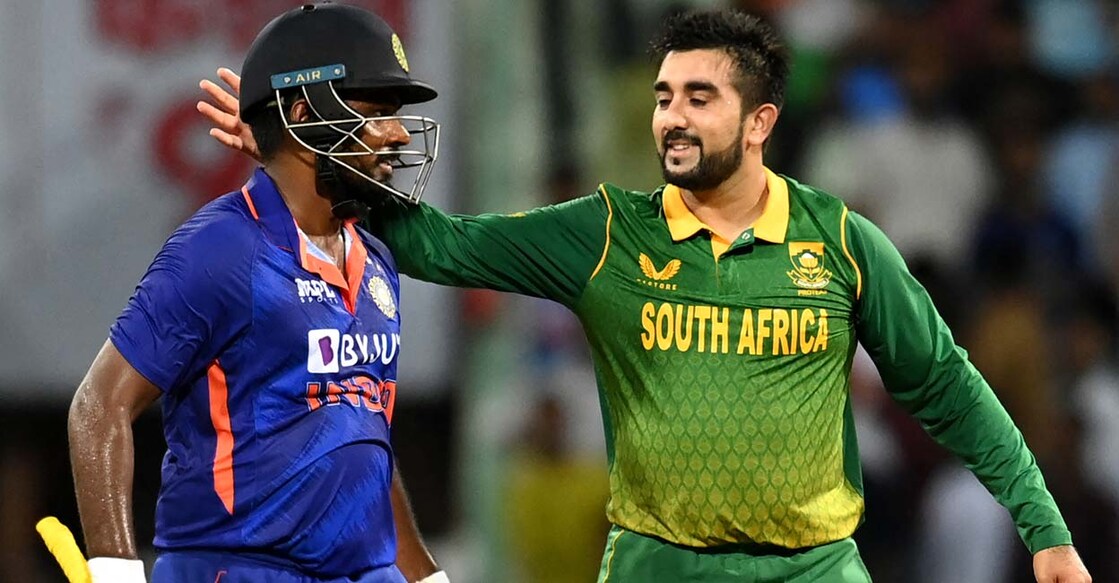 Sanju Samson gets a pat from Tabraiz Shamsi at the end of the game. Photo: AFP/Sajjad Hussain