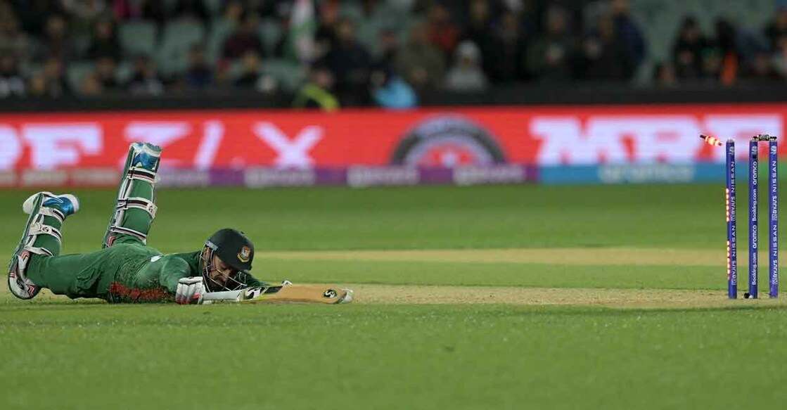 K L Rahul produced a brilliant direct hit while running in from the boundary to cut short Litton Das' blinder. Photo: AFP/Brenton Edwards 
