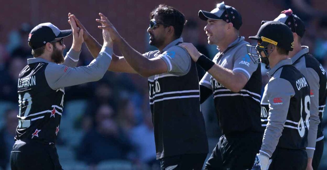 Ish Sodhi, centre, celebrates with Kane Willaimson after dismissing Paul Stirling. Photo: AFP/Brenton Edwards