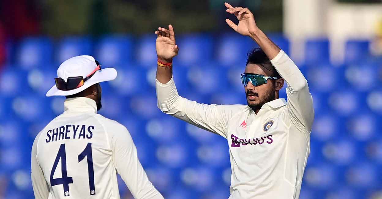 Axar Patel, right, celebrates with Shreyas Iyer after dismissing Mushfiqur Rahim. Photo: AFP/Munir Uz Zaman